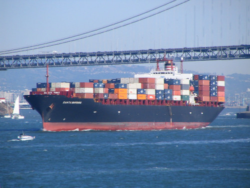 Large container ship traveling down a river