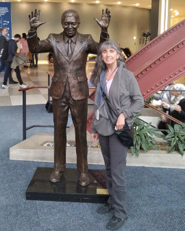 Heidi next to Bronze of Nelson Mandella