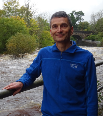 Neil Kitching standing by the Allan Waters river